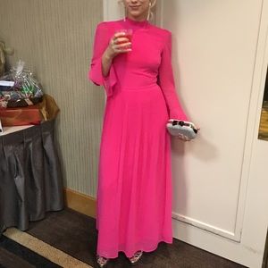 hot pink gown with bell sleeves and open back